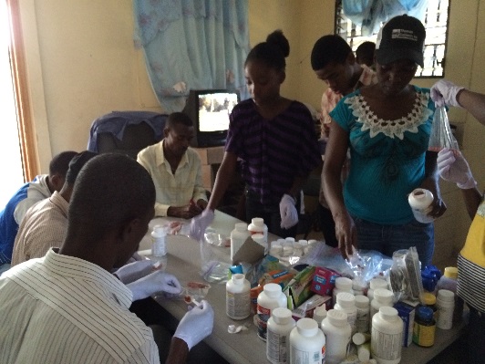 The EDAAD team prepares the medication and Hygiene kits